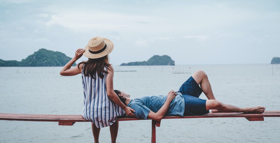 Young couple traveler relaxing and looking beautiful landscape, Travel lifestyle concept