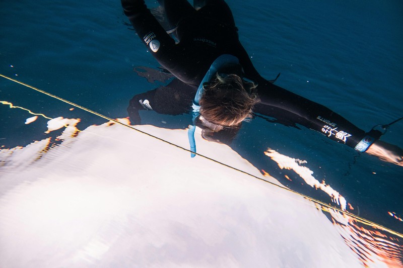 Freediver lying on a couch practicing dry breath hold training